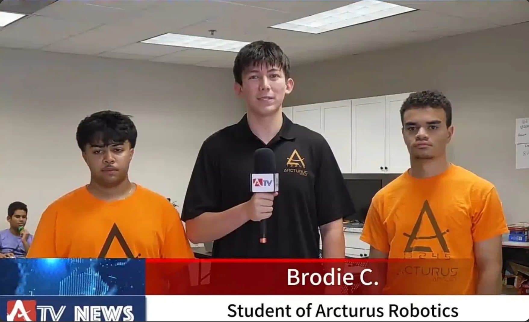 Brodie on camera with two Arcturus teammates — ATV News lower third reads “Brodie C., Student of Arcturus Robotics”