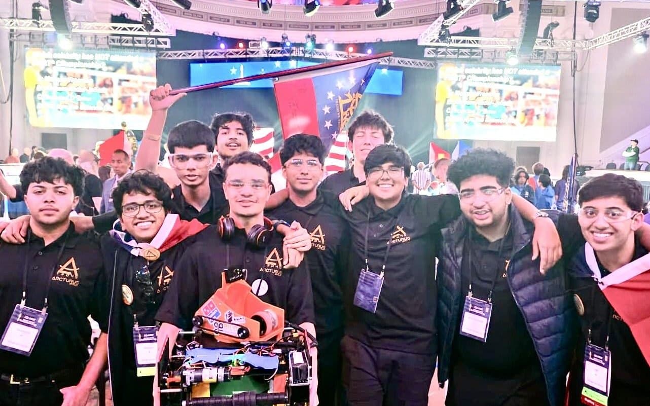 Team 13245 Arcturus–Apollo holding up the DECODE-season robot and the Georgia flag at the U.S. Governors Cup